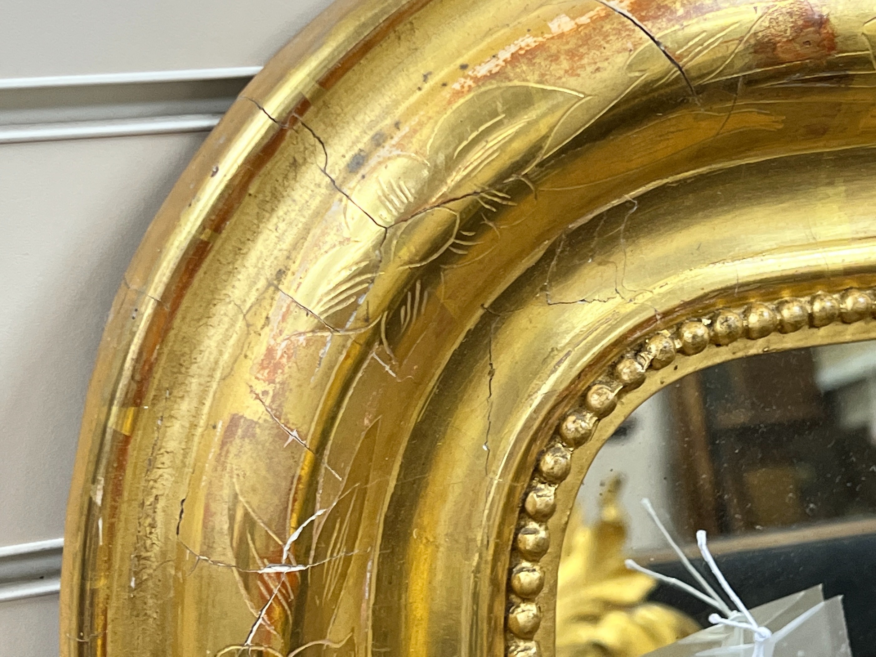 A 19th century French giltwood overmantel mirror, width 100cm, height 141cm